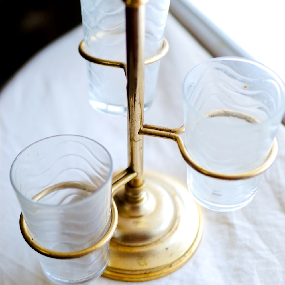 3 glass cups with gold brass holder